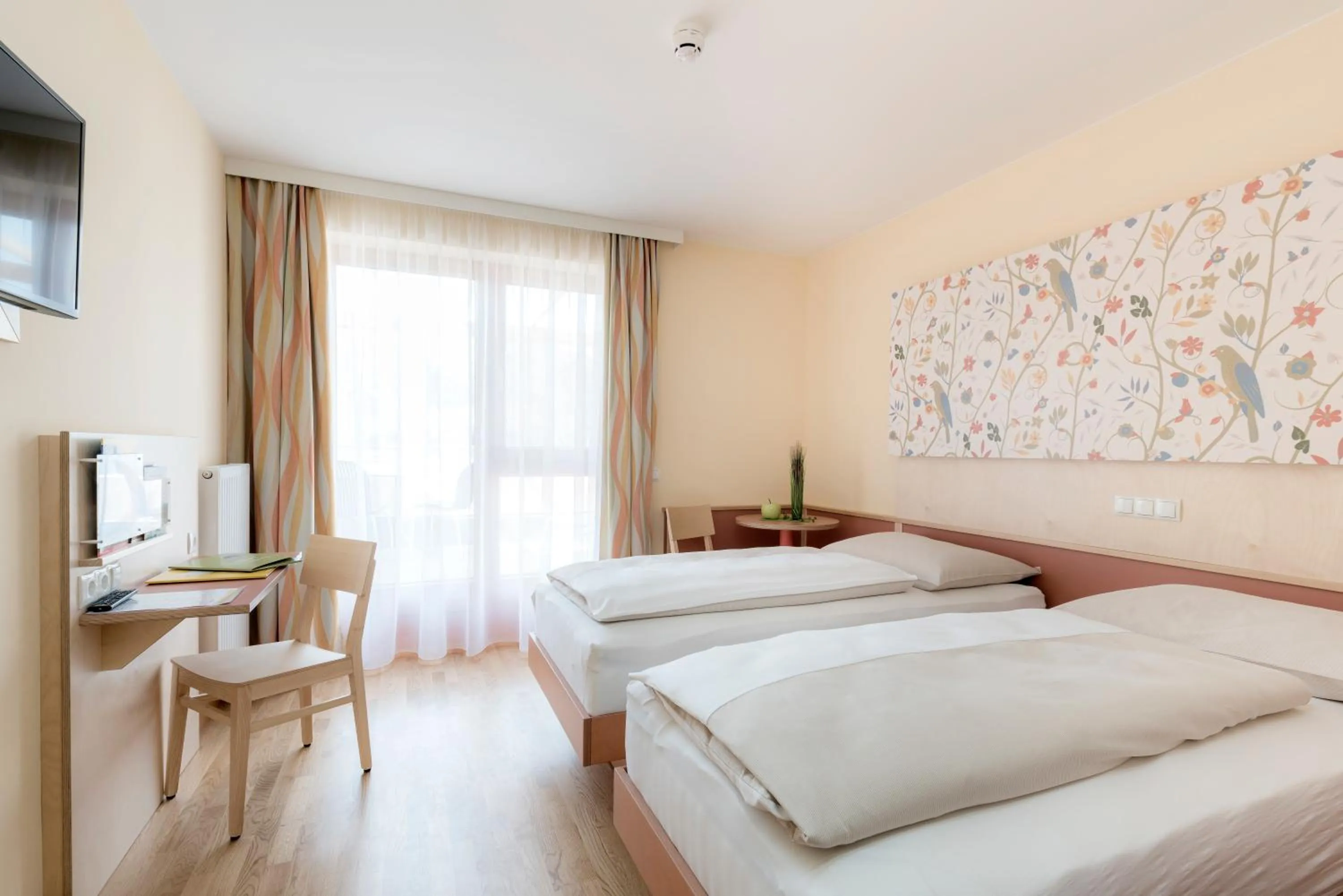 Photo of the whole room, Bed in JUFA Hotel Stubenbergsee