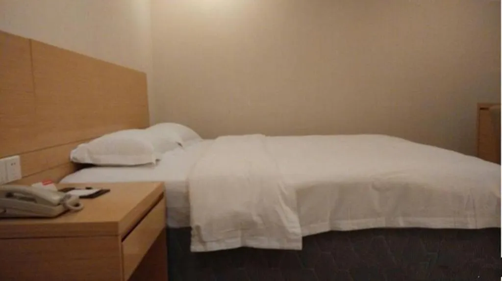 Bed in Ramada Encore by Wyndham Wuhan Int'l Conference Center