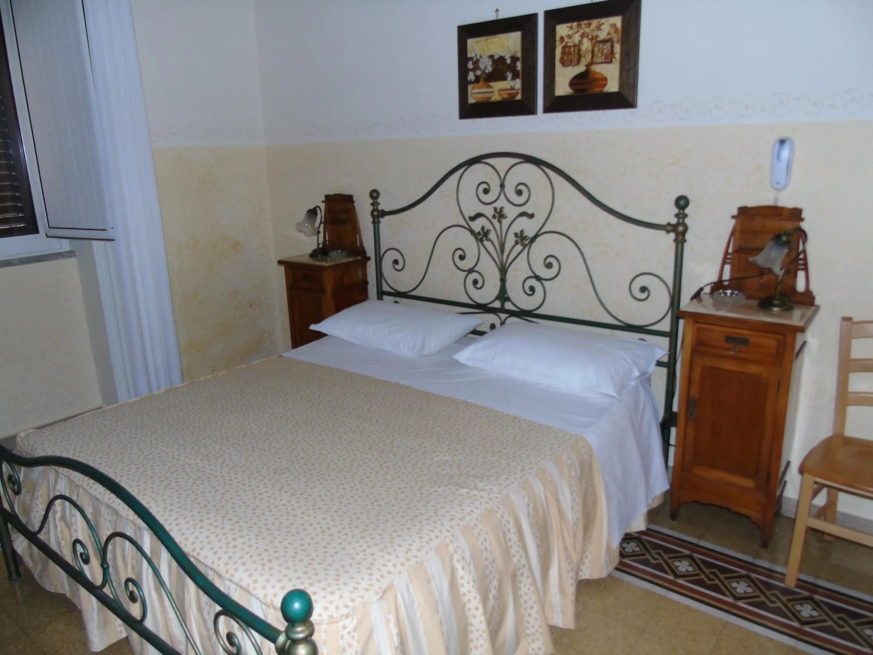 Bed in Albergo Cavour