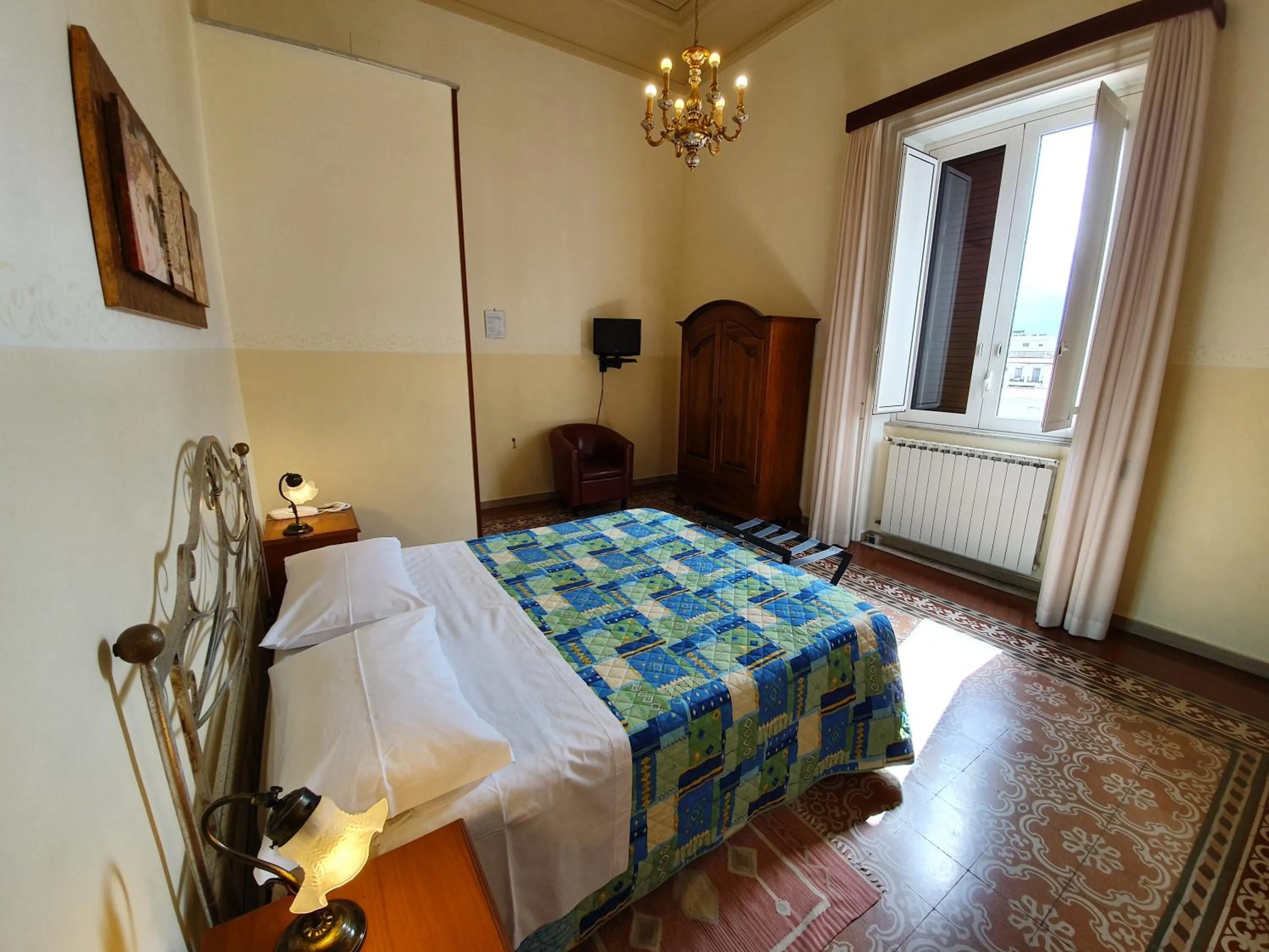 Bed in Albergo Cavour