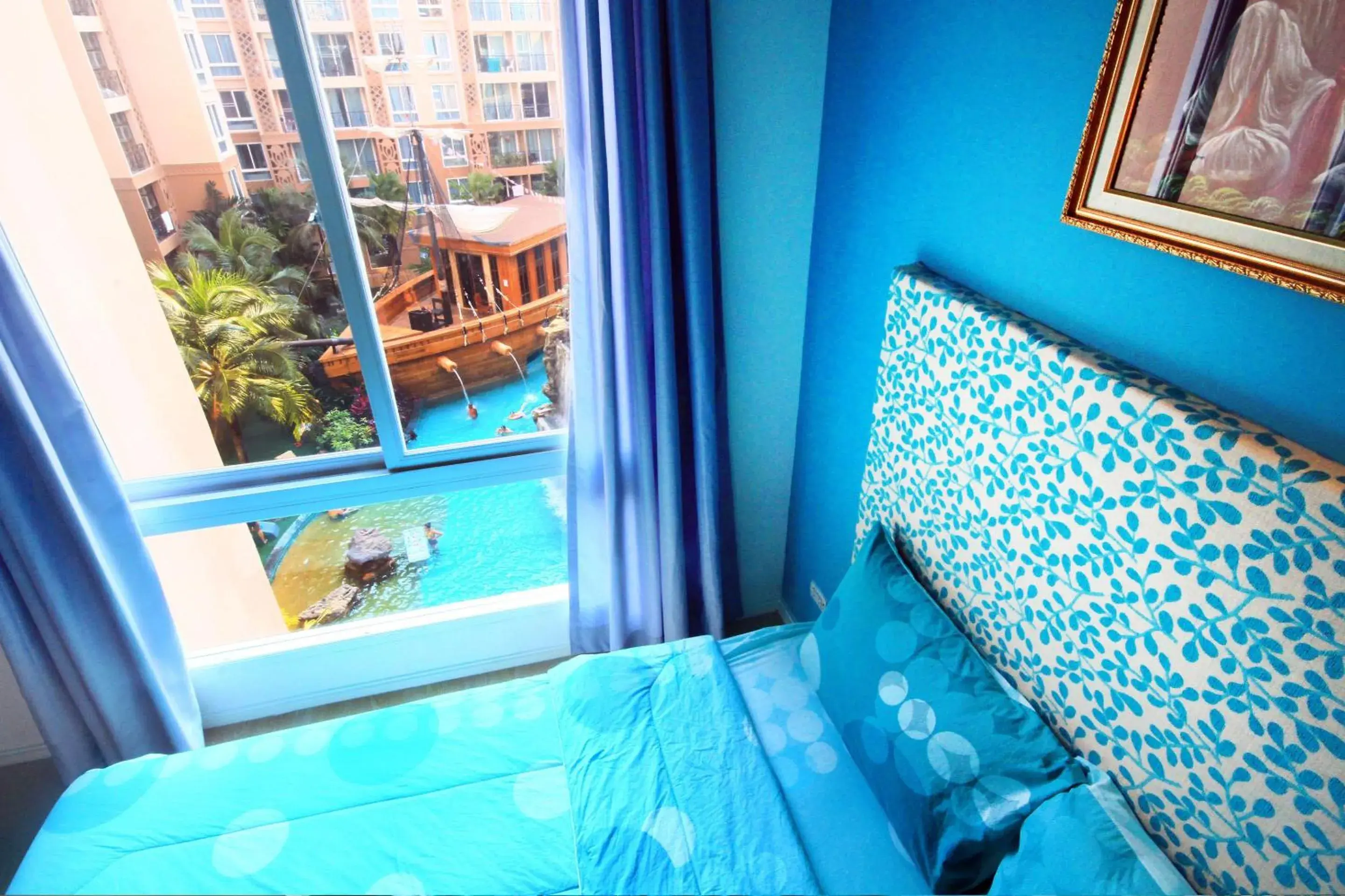 Bed, Pool View in Atlantis Condo & Water Park Pattaya By The Sea