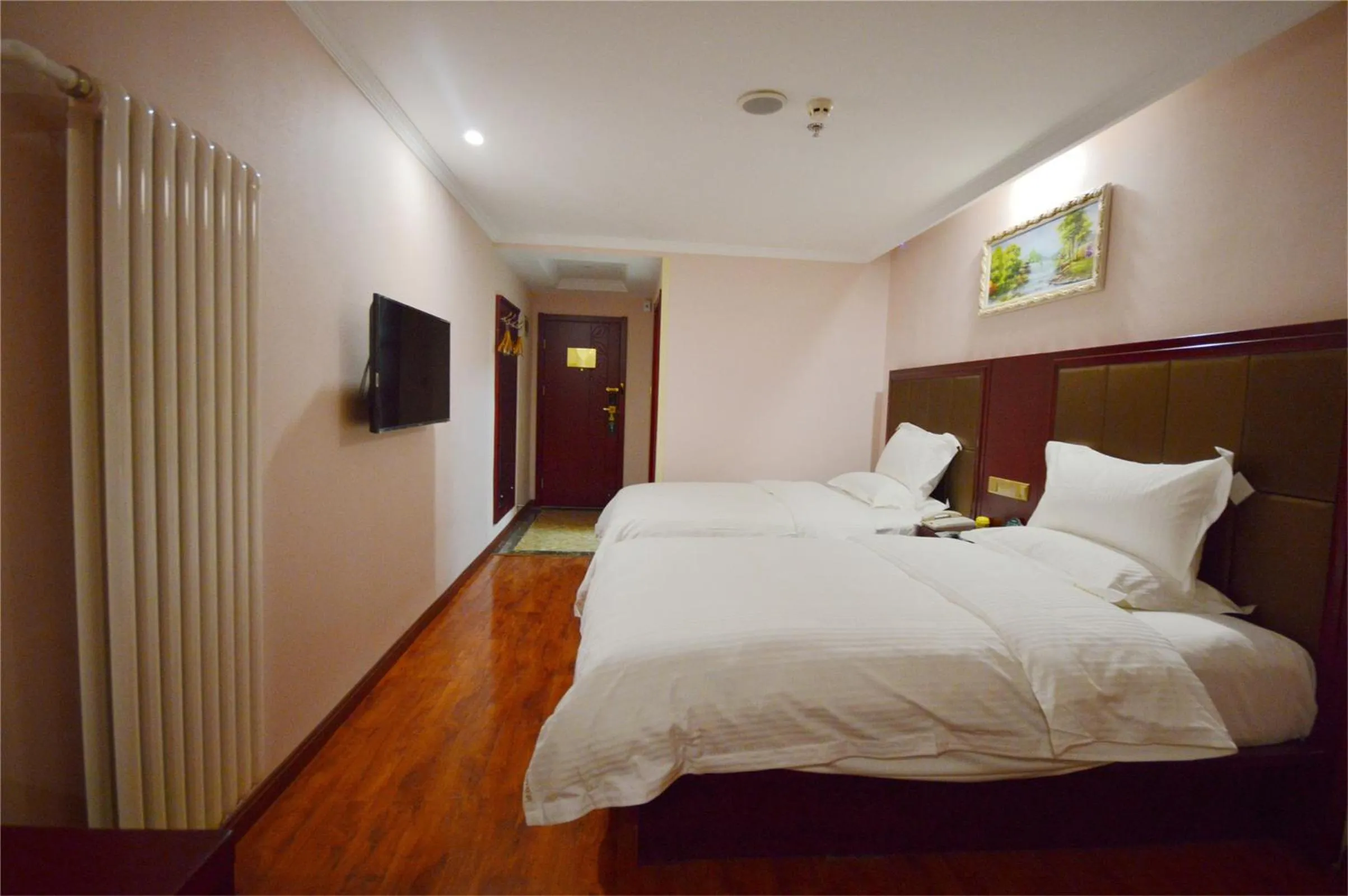 Bedroom in GreenTree Inn Shandong Linyi Bus Station Express Hotel