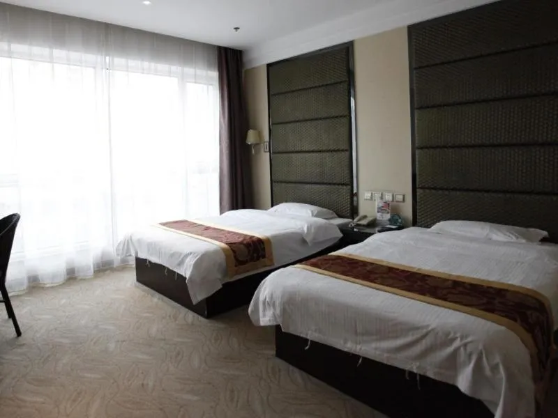 Bed in GreenTree Inn ShanDong North WeiHai StationNorth International Bathing Beach Business Hotel