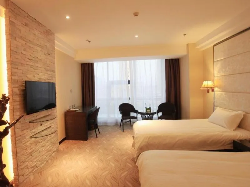 Bed in GreenTree Inn ShanDong North WeiHai StationNorth International Bathing Beach Business Hotel