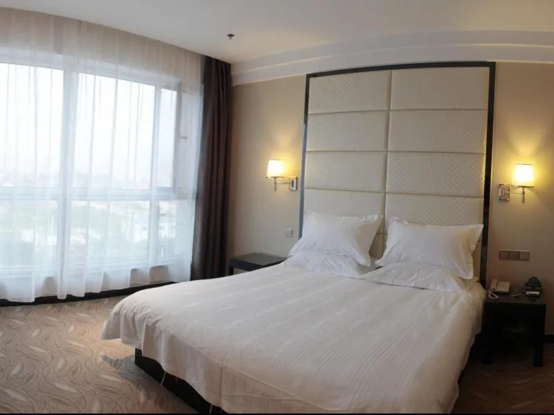 Bed in GreenTree Inn ShanDong North WeiHai StationNorth International Bathing Beach Business Hotel