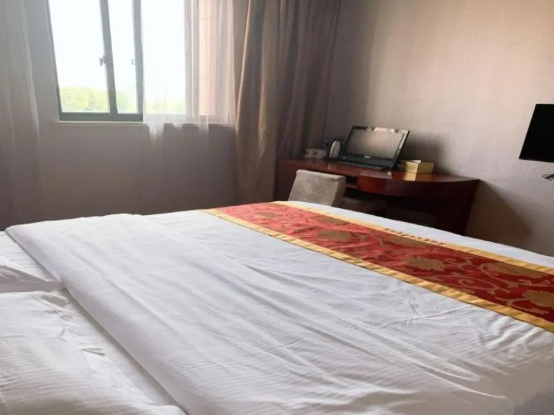 Bed in GreenTree Inn Jiangsu Wuxi Xibei Town Xingtiandi Shell Hotel