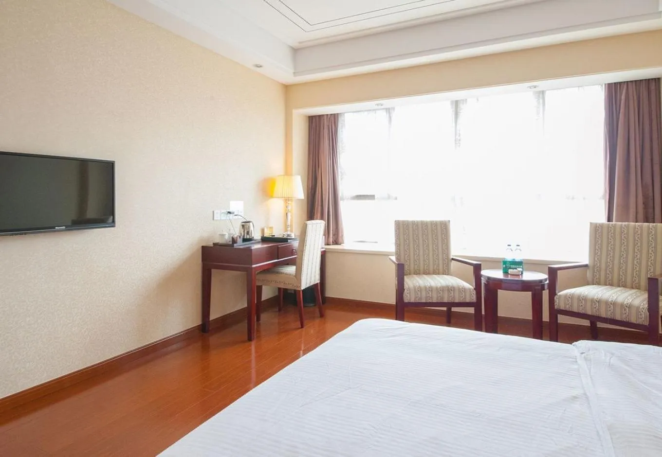 Bed in GreenTree Inn Jiangsu Nantong Haimen Sanchang North Wangjiang Road Business Hotel