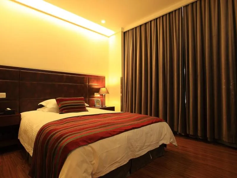 Bed in GreenTree Inn Jiangsu Nantong Qidong Middle Heping Road Business Hotel