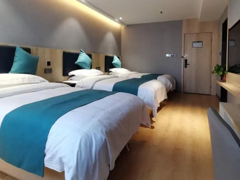 Bed in GreenTree Inn Jiangsu Nantong Textile City Bus Station Express Hotel
