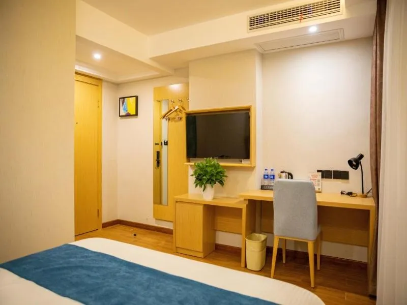 Bed in GreenTree Inn Nantong Hai'an Mingzhu City Express Hotel