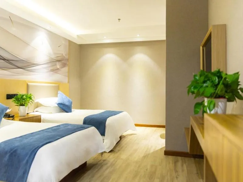 Bed in GreenTree Inn Nantong Hai'an Mingzhu City Express Hotel