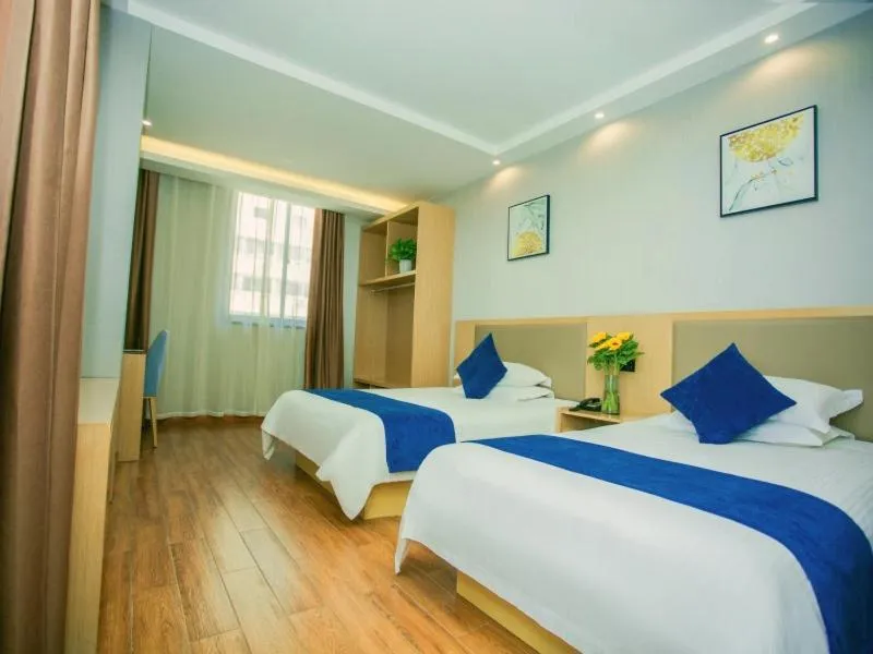 Bed in GreenTree Inn Nantong Hai'an Mingzhu City Express Hotel