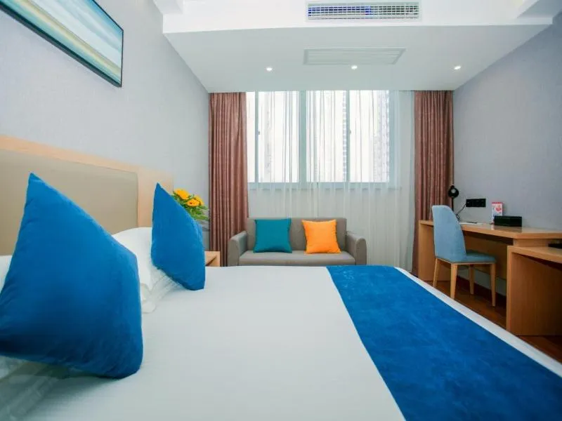 Bed in GreenTree Inn Nantong Hai'an Mingzhu City Express Hotel