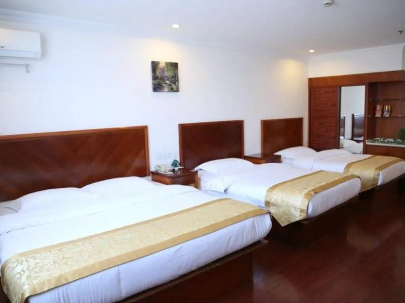 Bed in GreenTree Inn Jiangsu Taizhou Taidong Railway Station Business Hotel