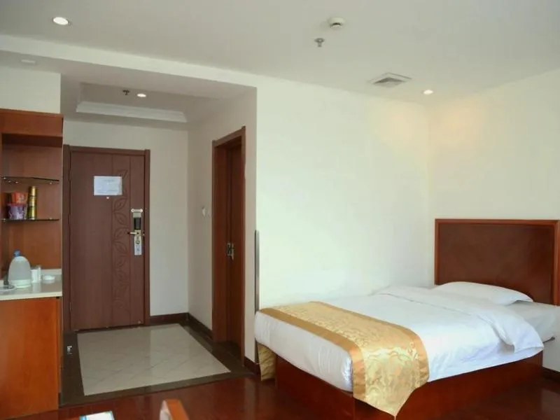 Bed in GreenTree Inn Jiangsu Taizhou Taidong Railway Station Business Hotel