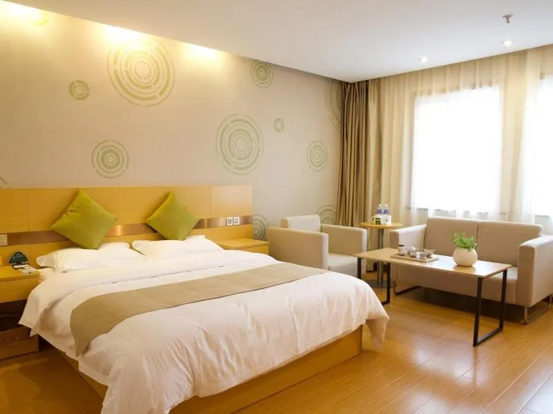 Bed in GreenTree Inn Zhejiang Shaoxing Xinchang Buddha Express Hotel