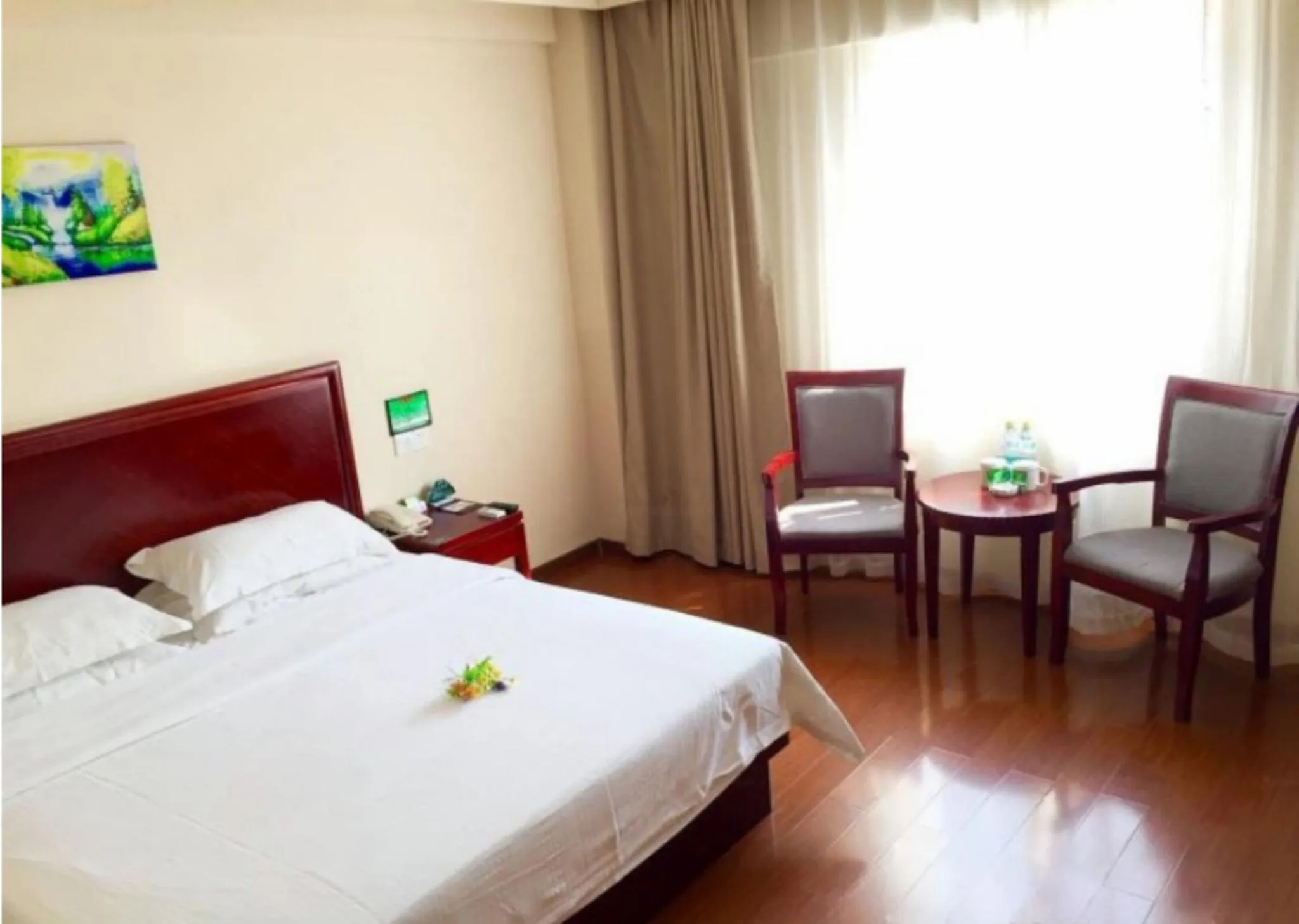 Bed in GreenTree Inn Hainan Haikou Guomao Business Hotel
