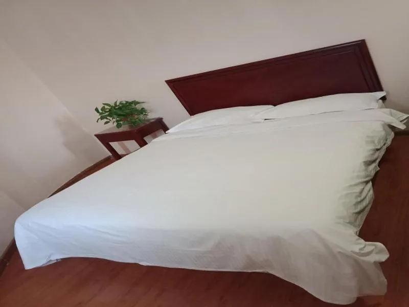 Bed in GreenTree Inn Shandong Jining Zoucheng South Yishan Road Experimental Middle School Express Hotel