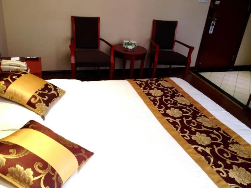 Bed in GreenTree Inn Xinjiang Bole Wanxianghui Express Hotel