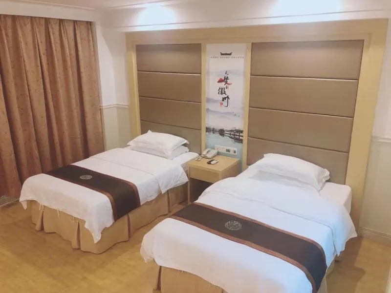 Bed in GreenTree Inn AnHui HuangShan She County HuiZhou Ancient City Middle HuangShan Road Business Hotel