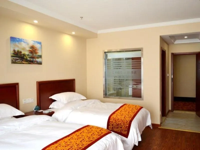 Bed in GreenTree Inn JiangSu NanTong BaiDian Town XiuShuiYuan Express Hotel