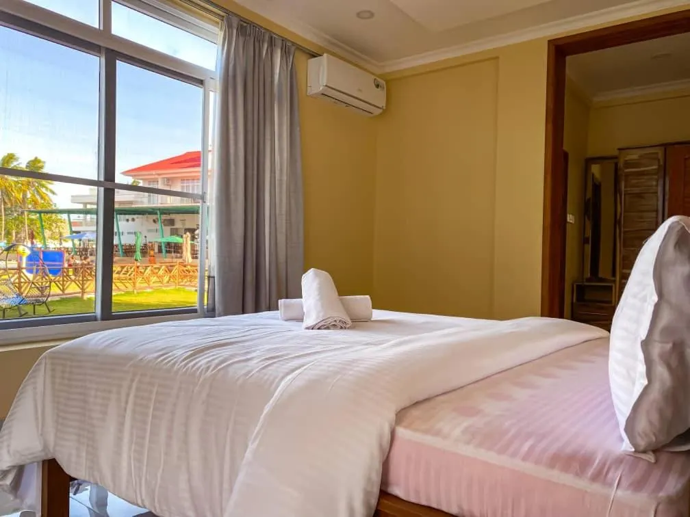 Bed in SUN n SAND BEACH RESORT