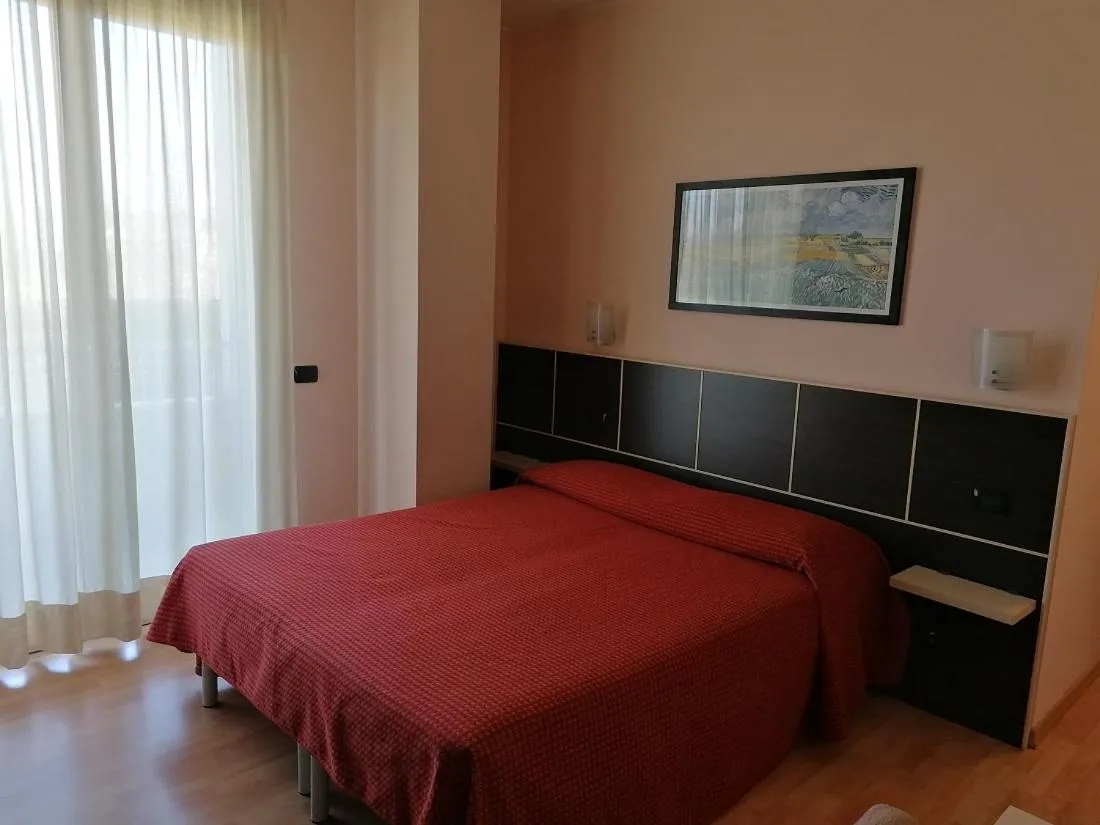 Bed in Hotel Residence Zodiaco