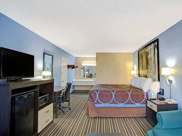 Bed in Downtown Inn & Studio Suites