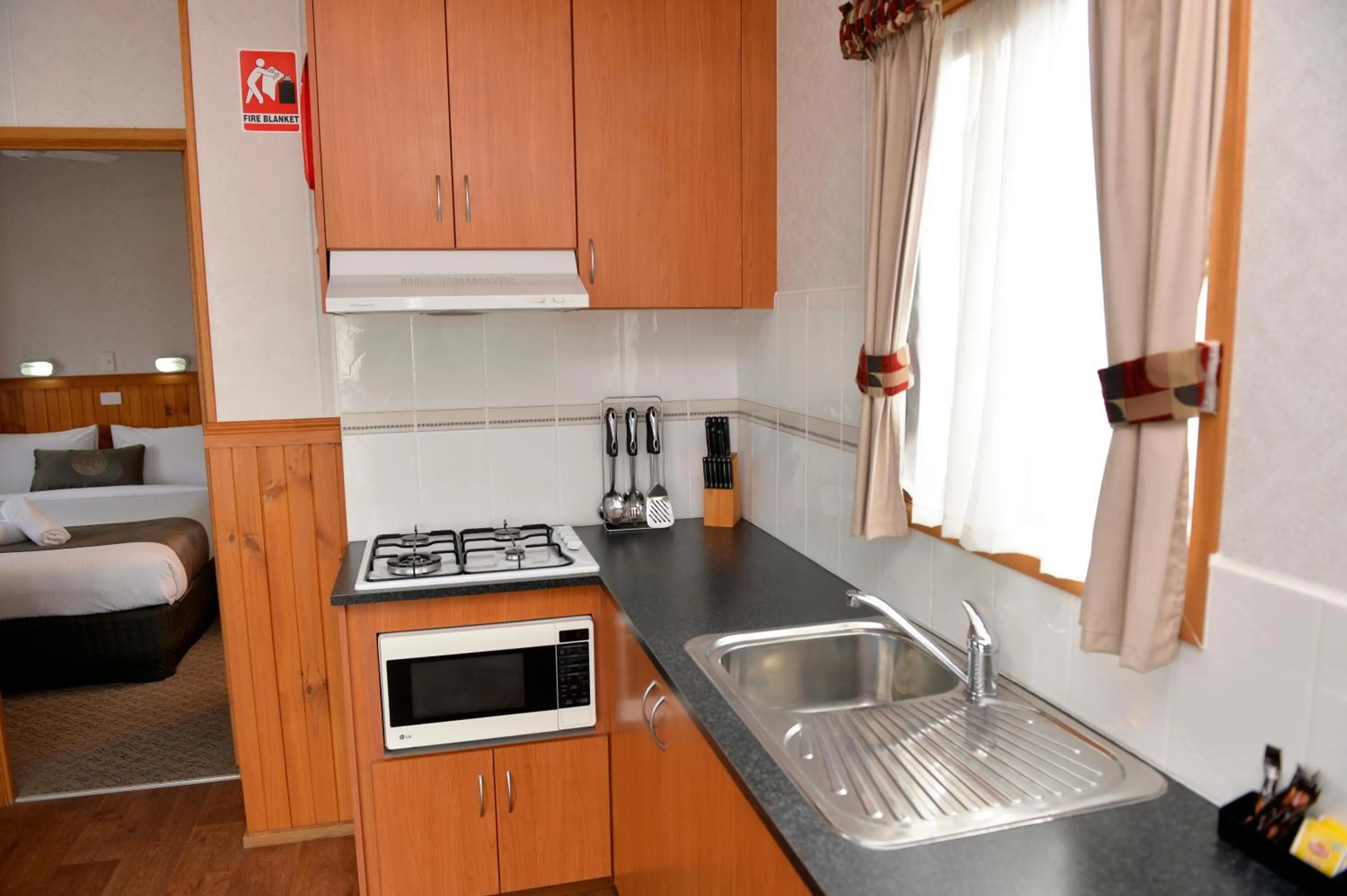Kitchen or kitchenette in Riverside Cabin Park