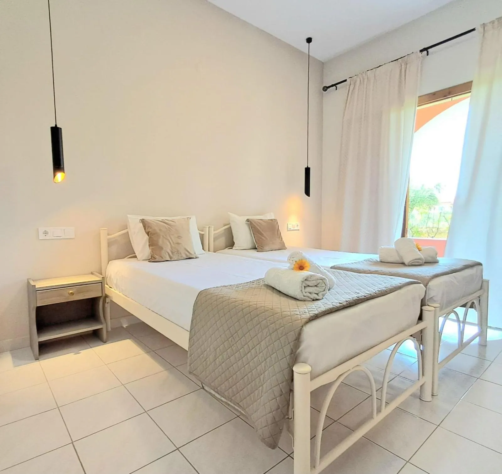 Bed in Olga's Garden Apartments