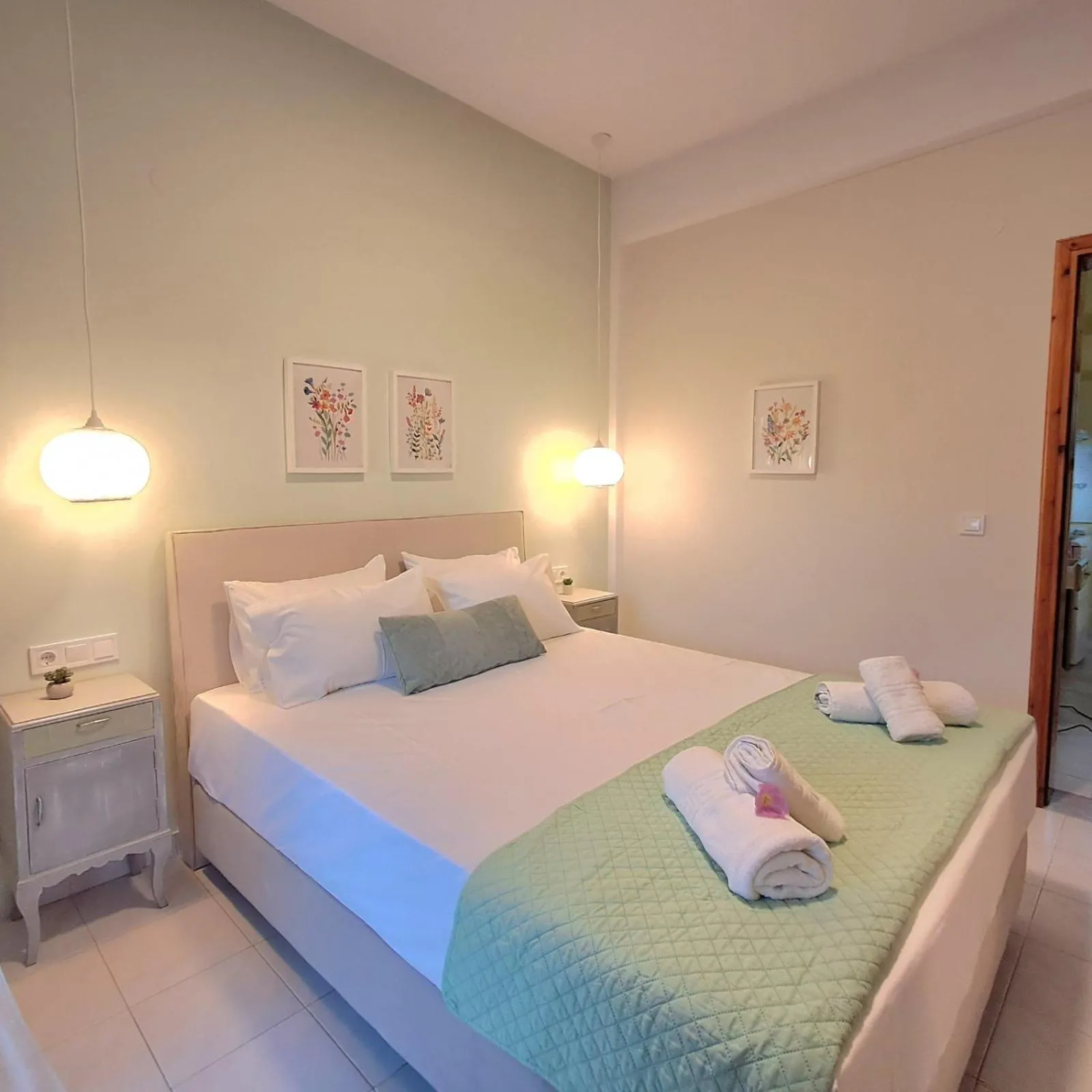 Bed in Olga's Garden Apartments
