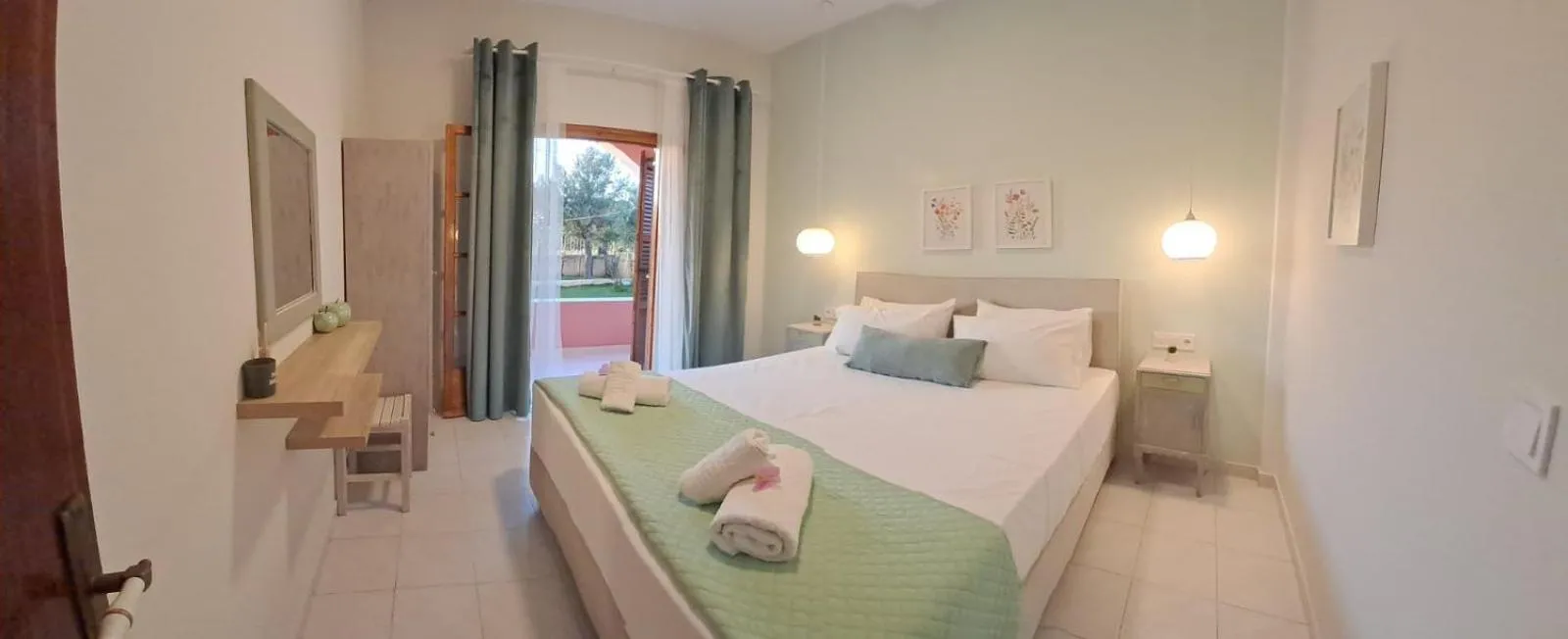 Bed in Olga's Garden Apartments