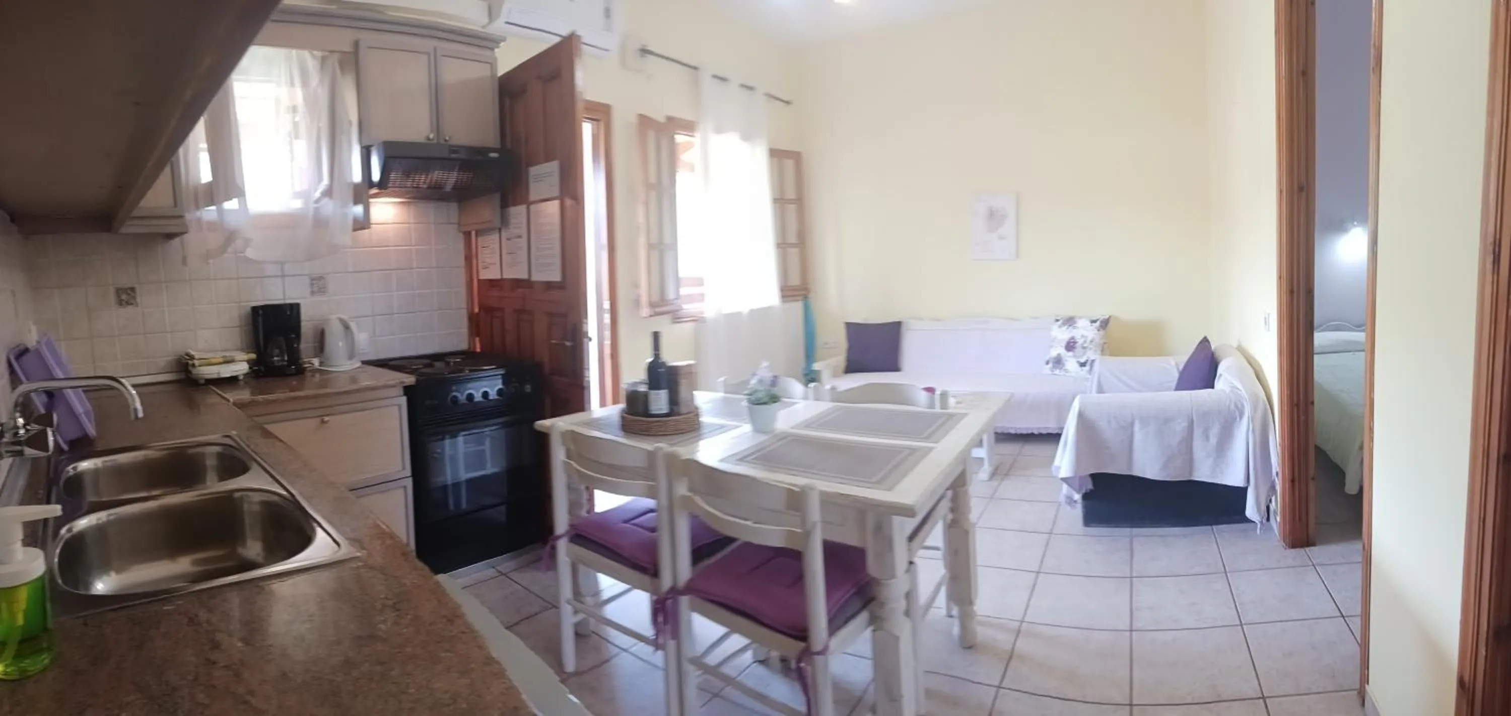 Kitchen or kitchenette, Bed in Olga's Garden Apartments