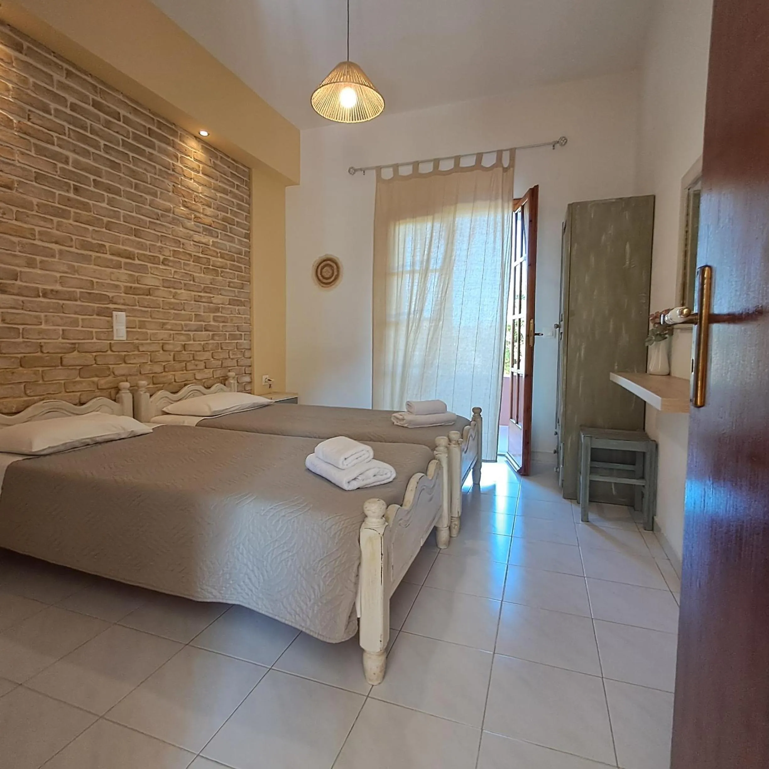 Bed in Olga's Garden Apartments