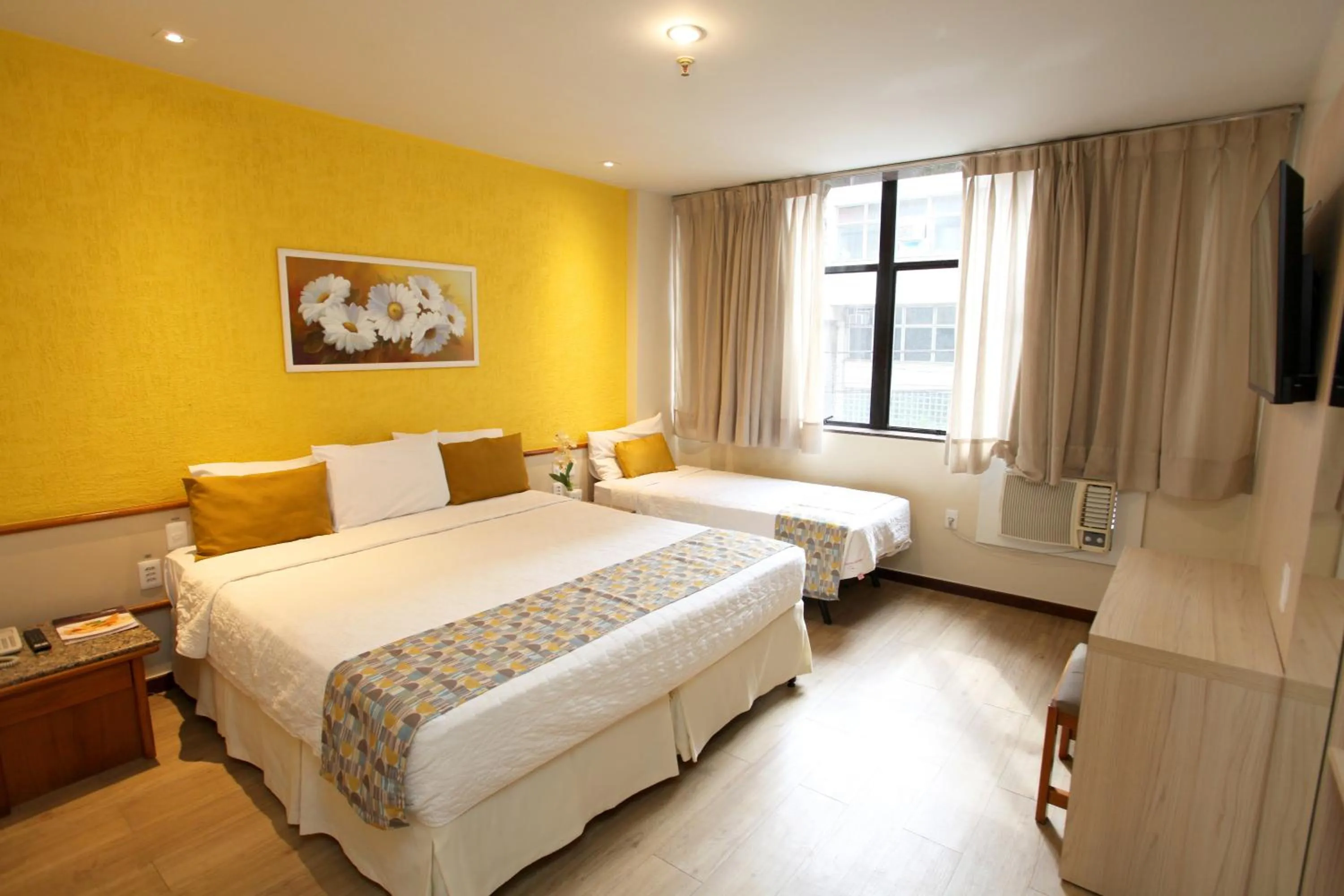 Communal lounge/ TV room, Bed in Mengo Palace Hotel