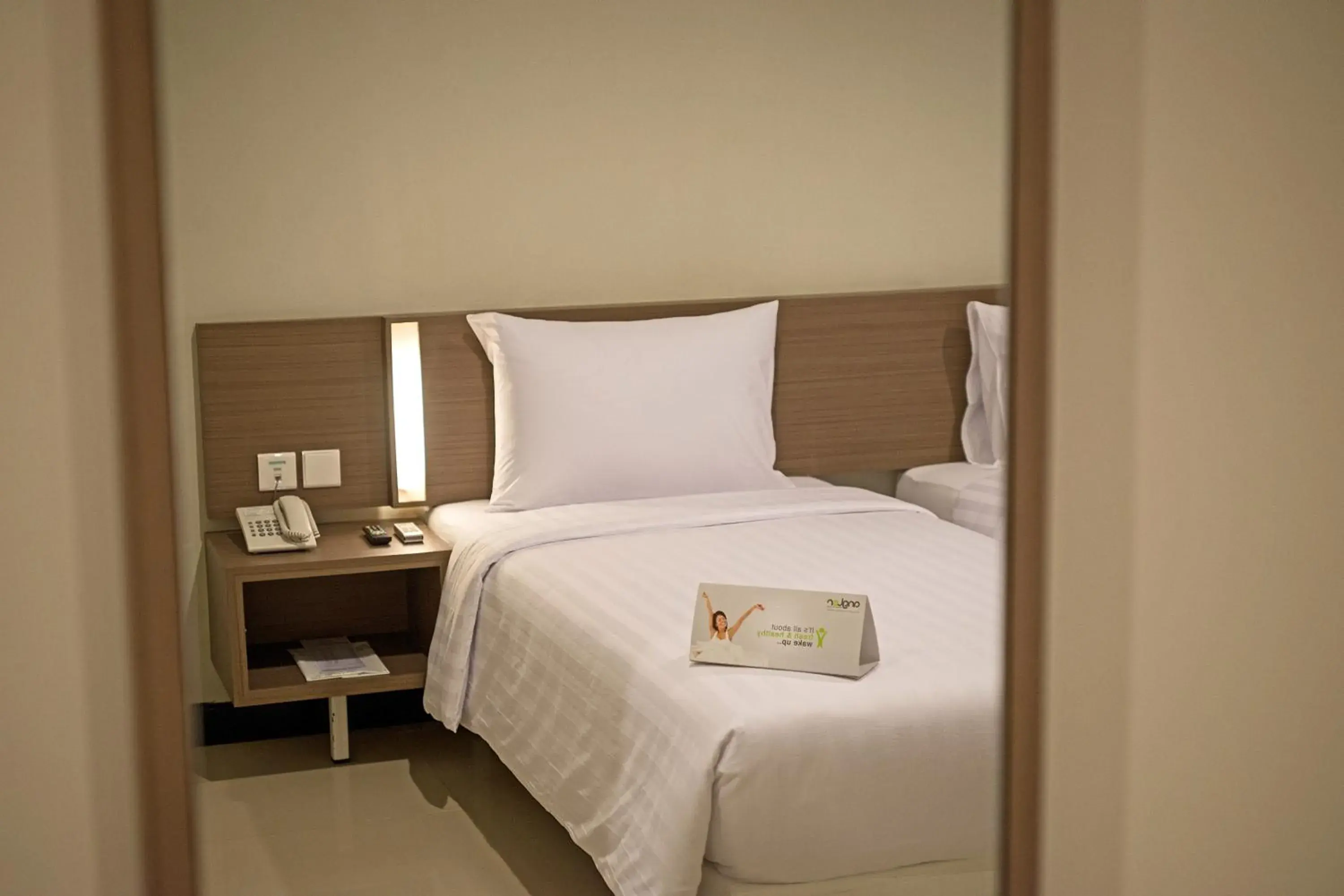 Bed in Whiz Prime Hotel Darmo Harapan Surabaya