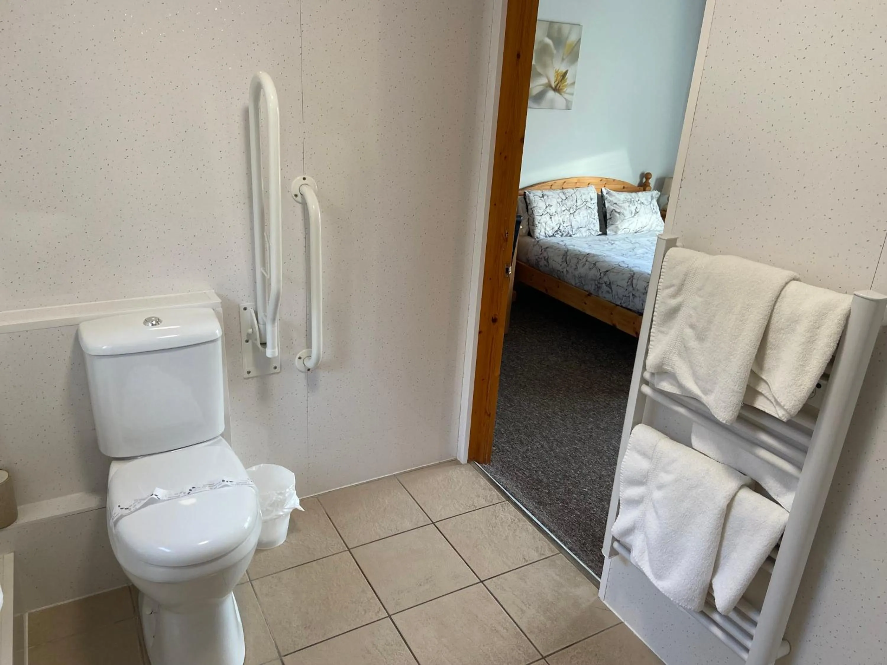 Bed in Forest Edge Motel