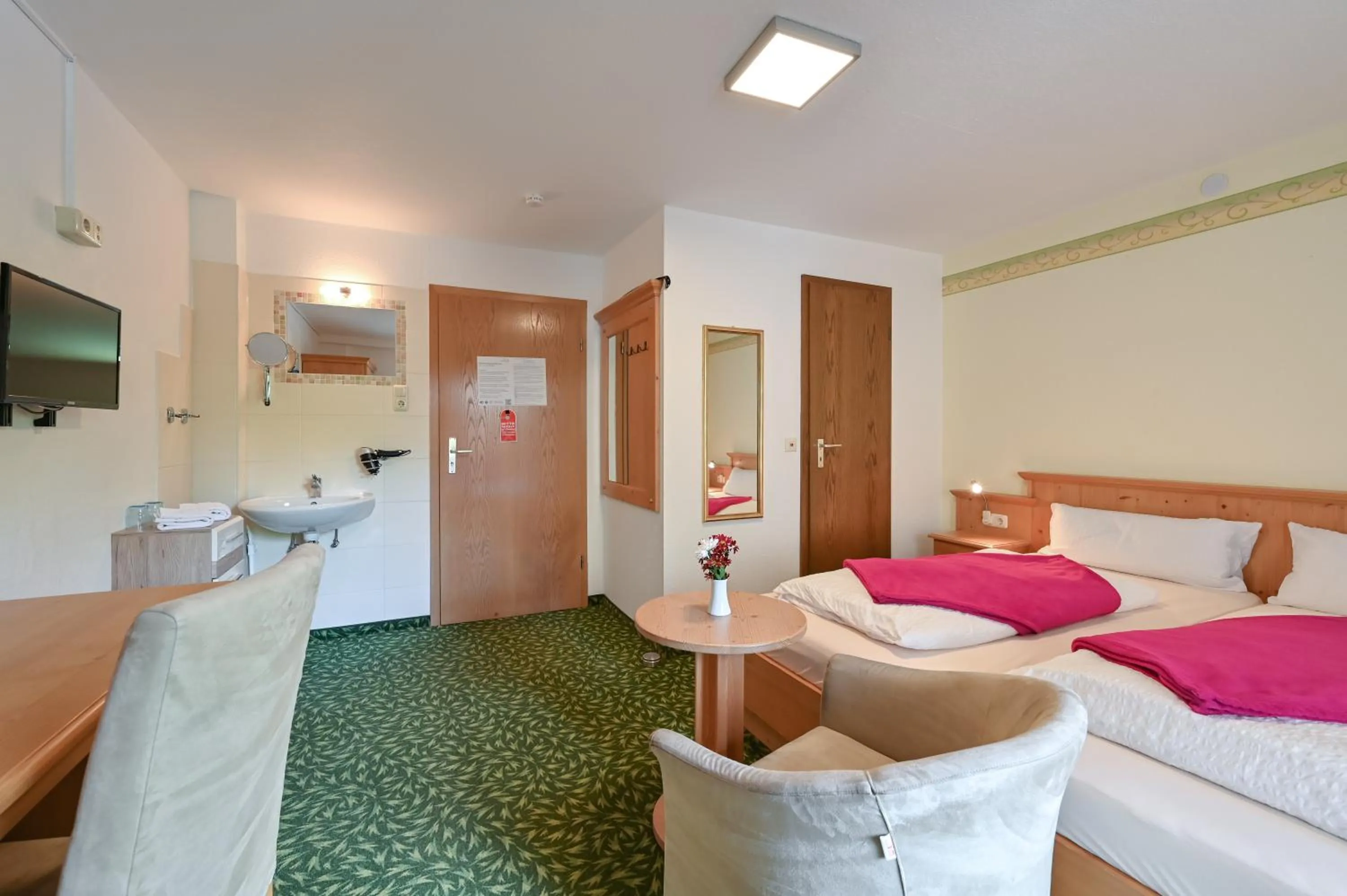 Seating area, Bed in Pension Freiheit