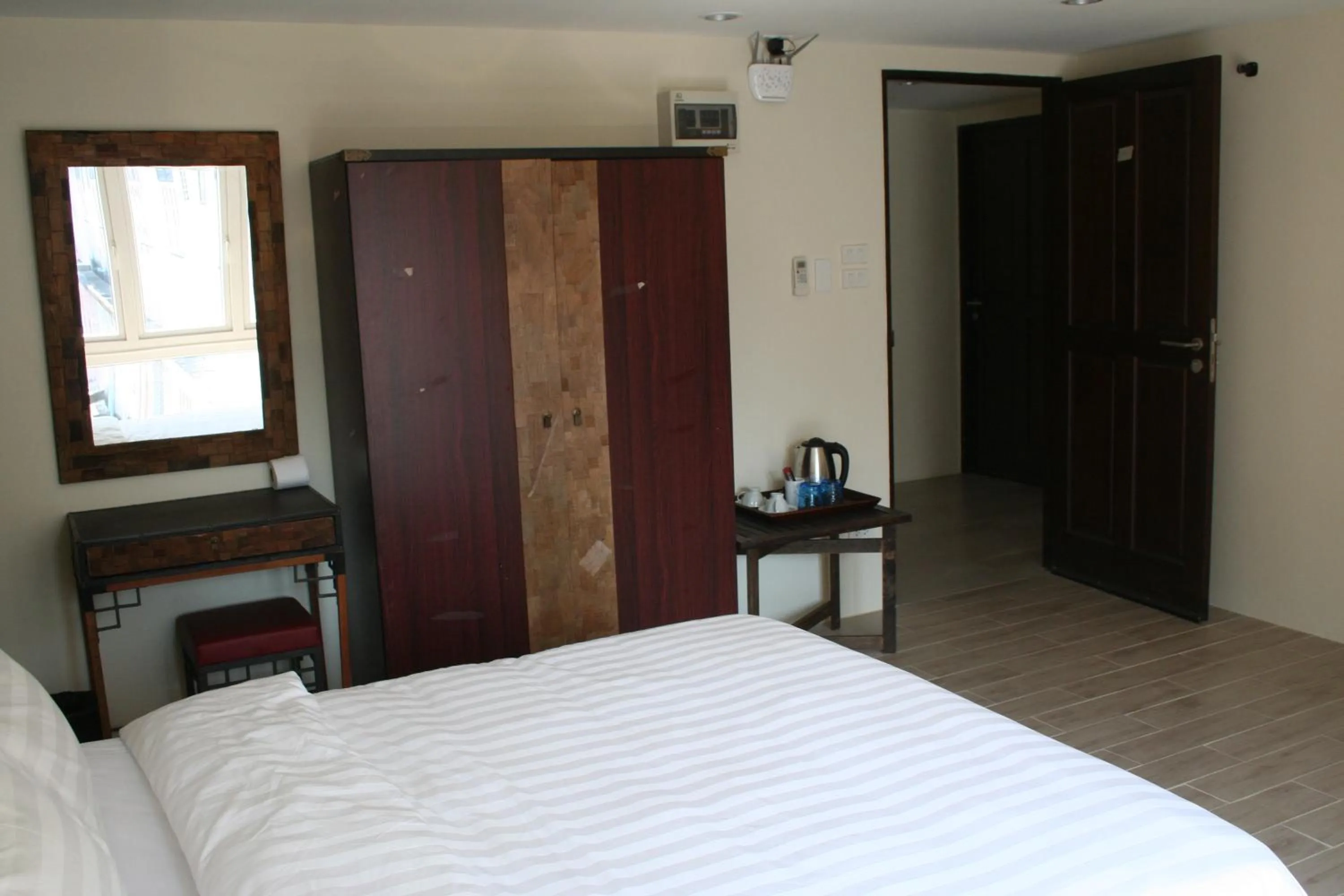 Bed in Arcadia Maephim Serviced Apartments