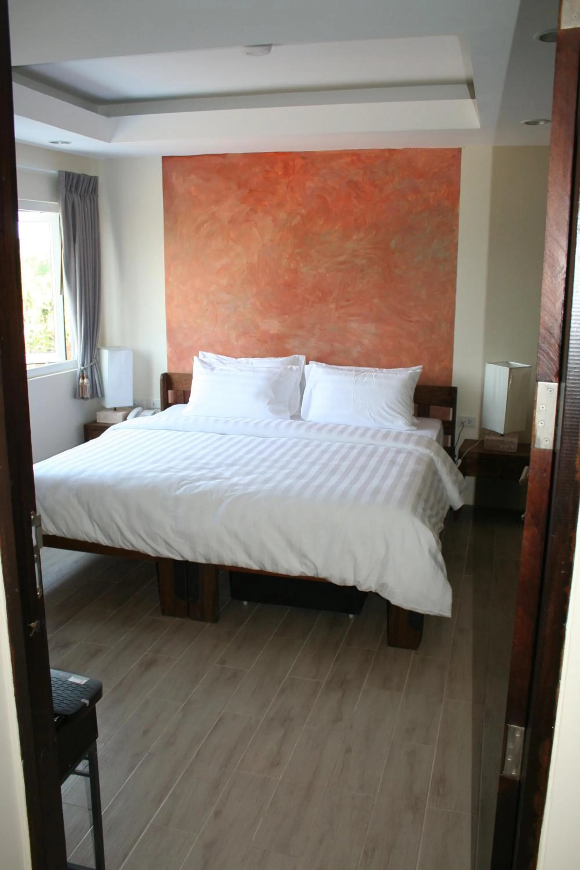 Bed in Arcadia Maephim Serviced Apartments