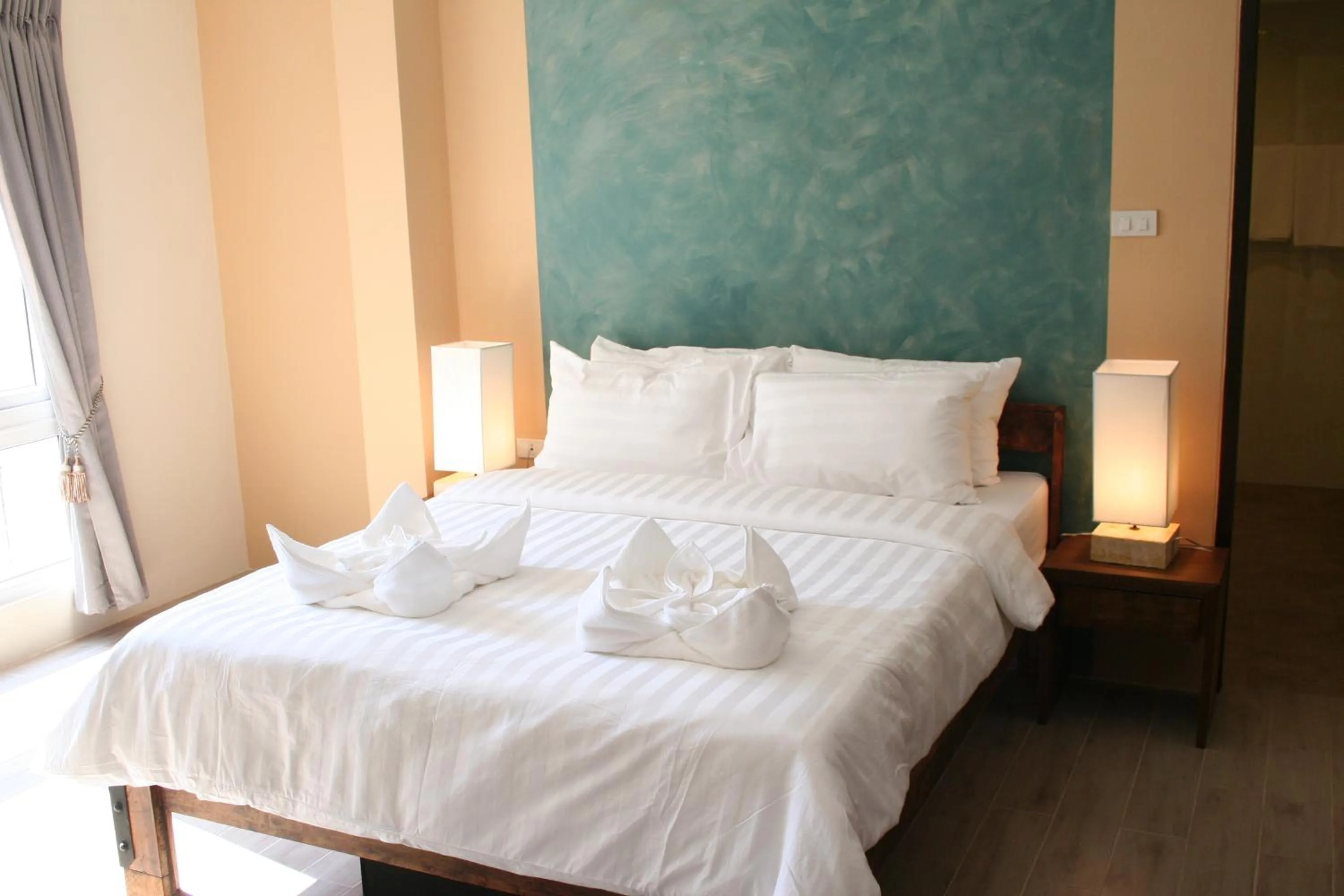 Bed in Arcadia Maephim Serviced Apartments