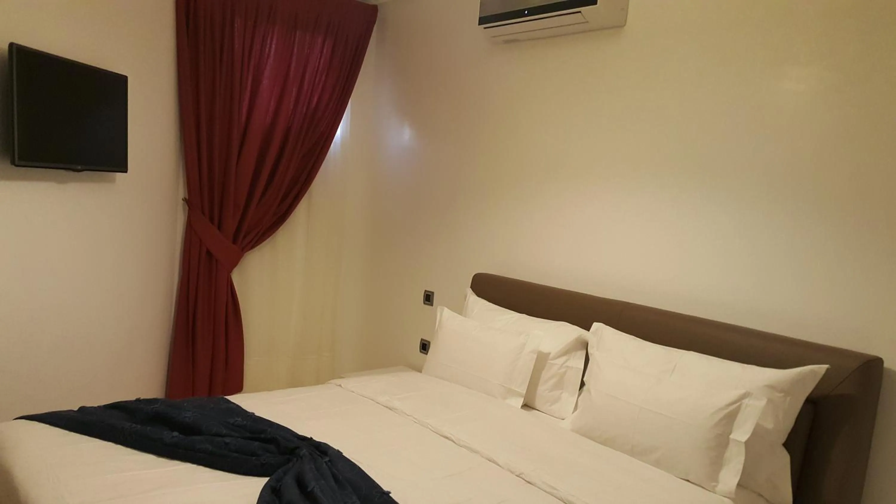 Bed in Appart Hôtel Mouna