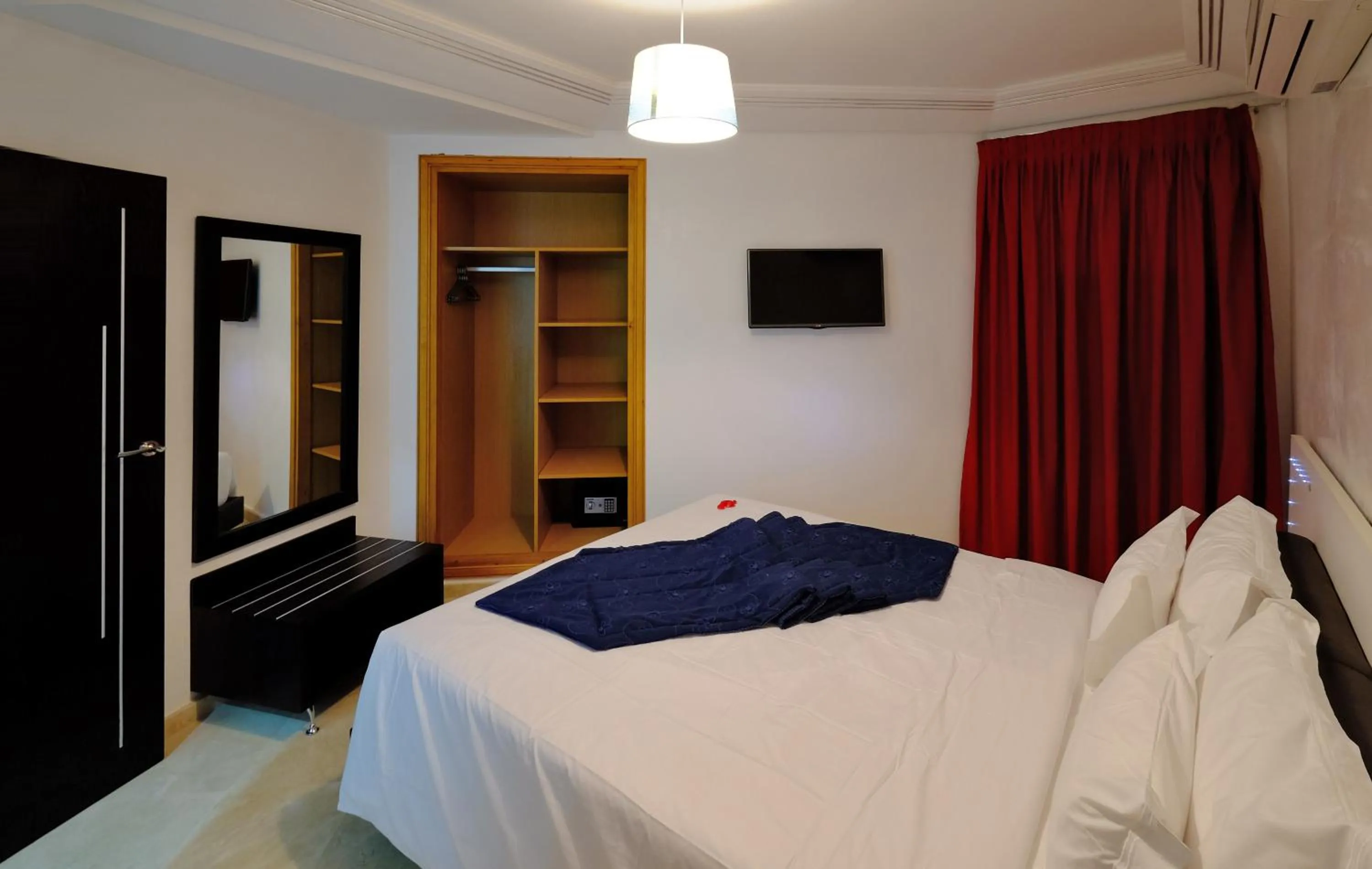 Bed in Appart Hôtel Mouna