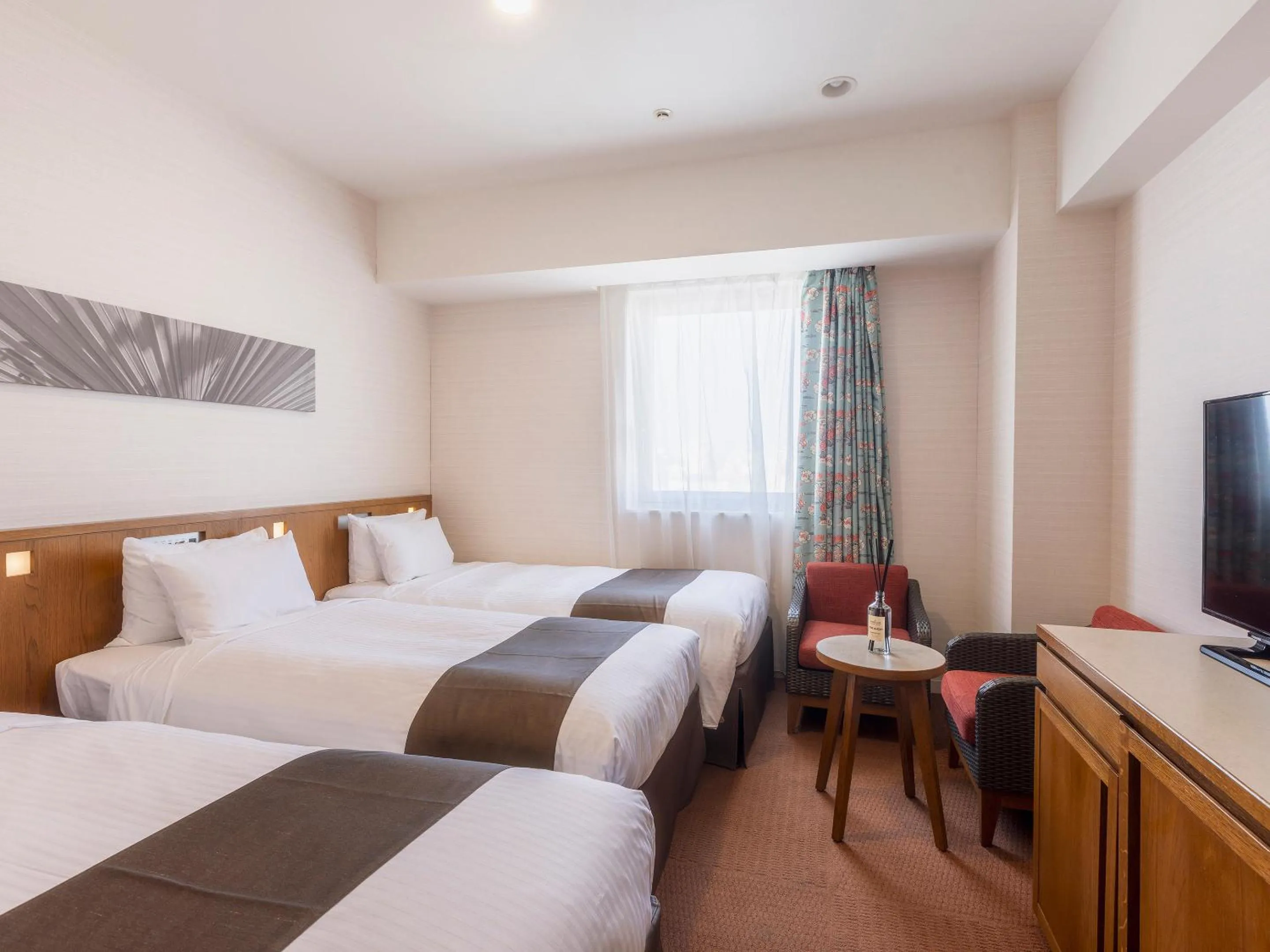 Bed in Hotel Gracery Naha