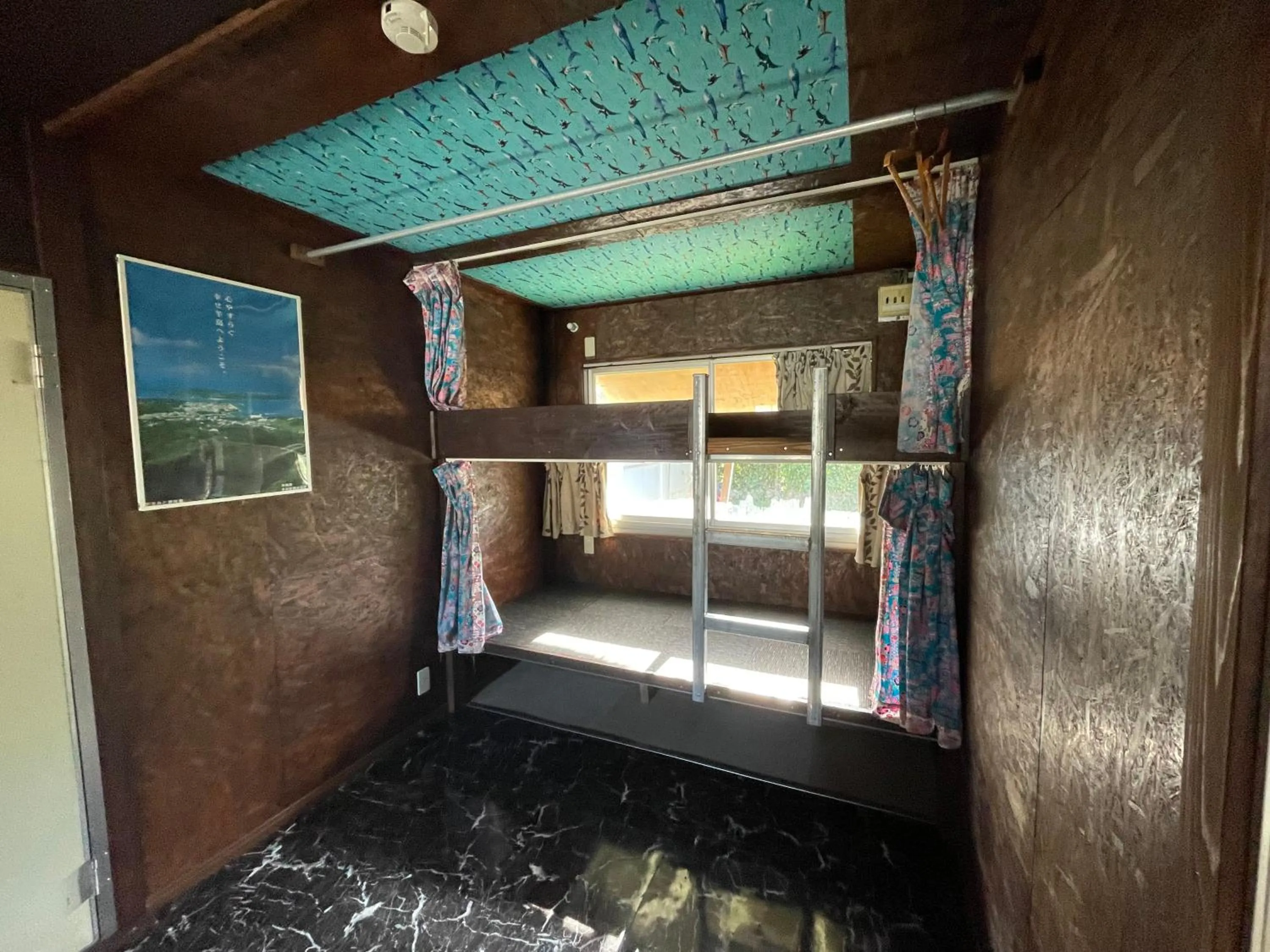 Bed in Sesoko Island Guest House Kafuu Village