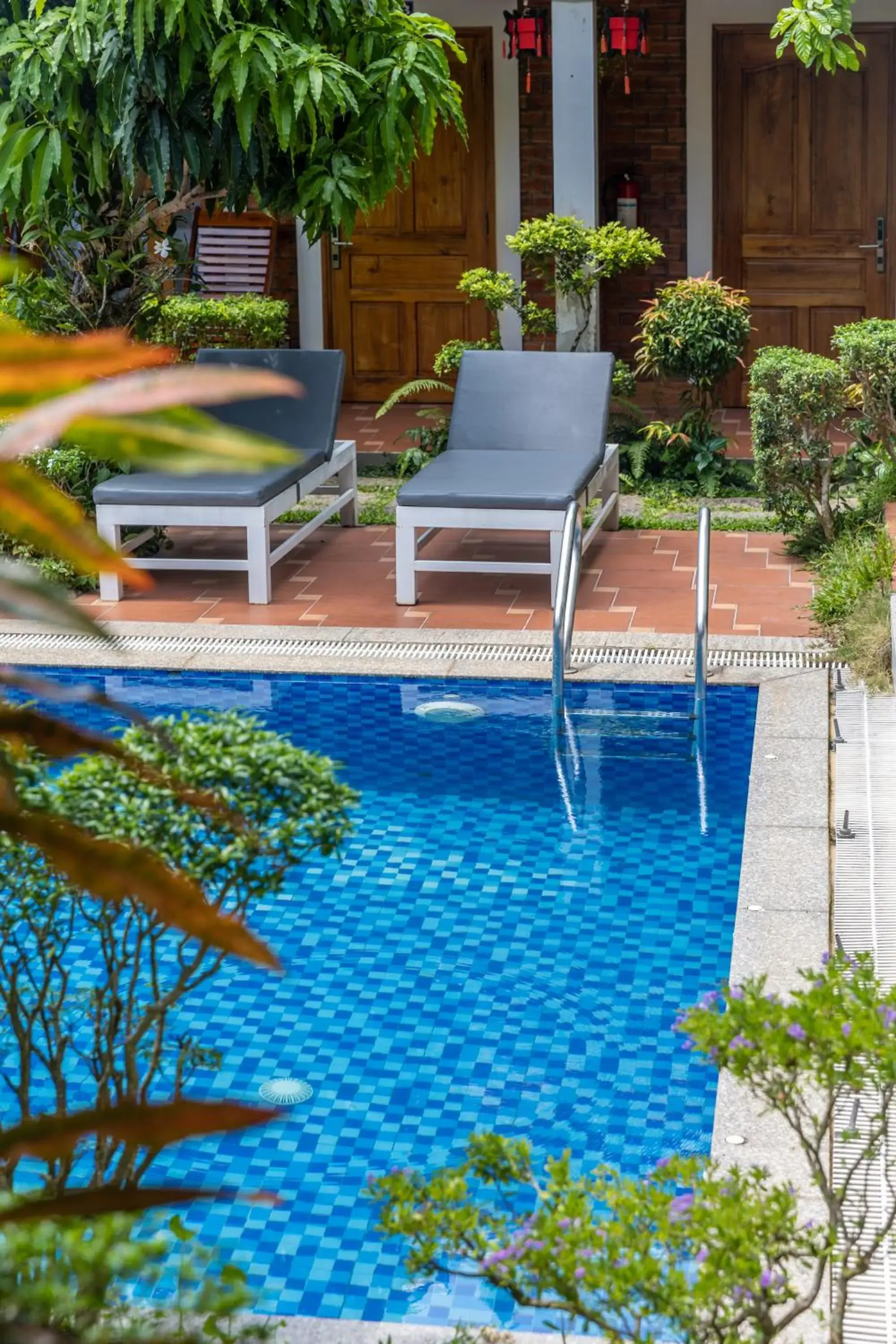 Pool view in Little Garden Bungalow Pool view in Little Garden Bungalow