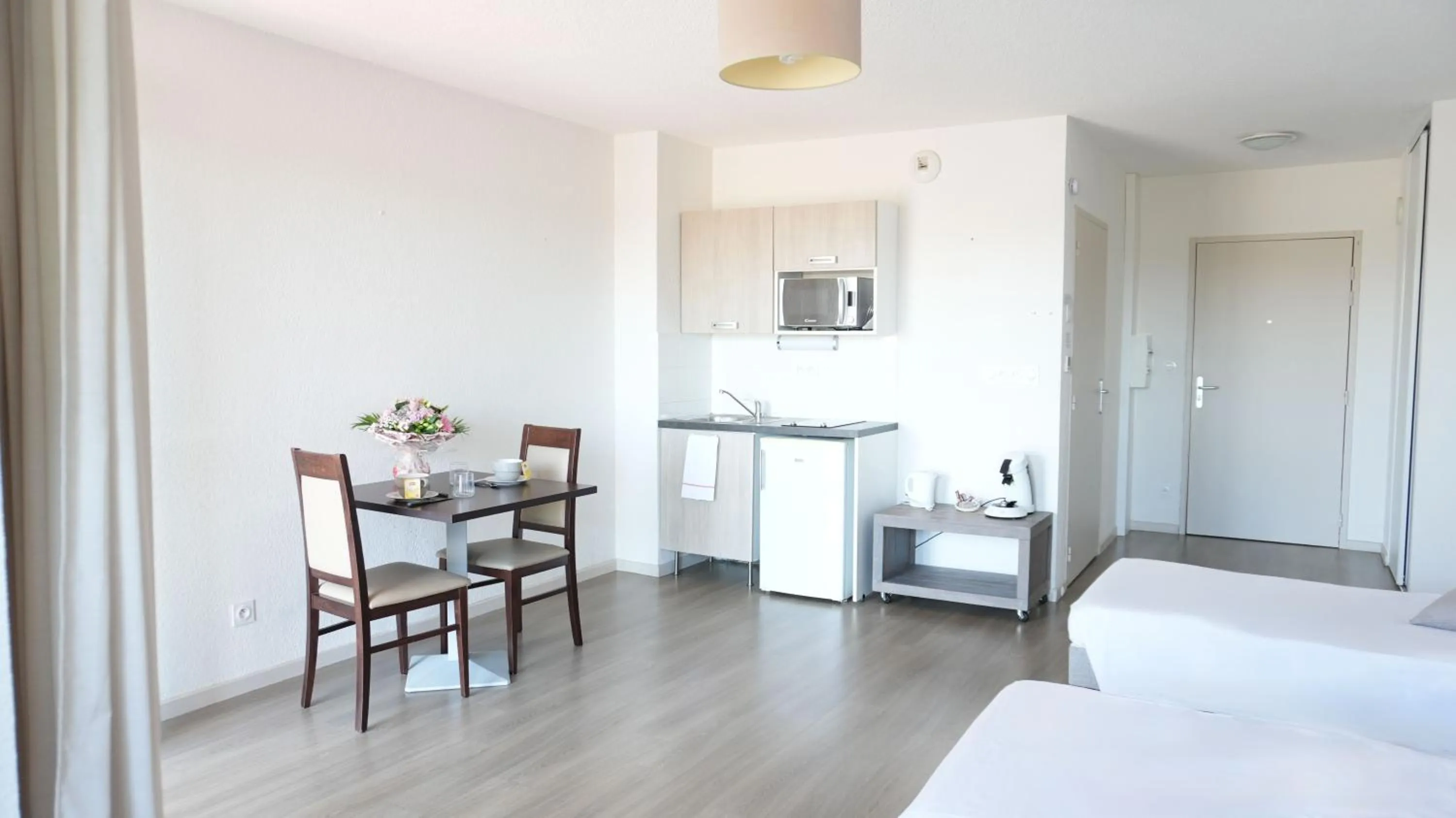 Bed in Zenao Appart'Hotel