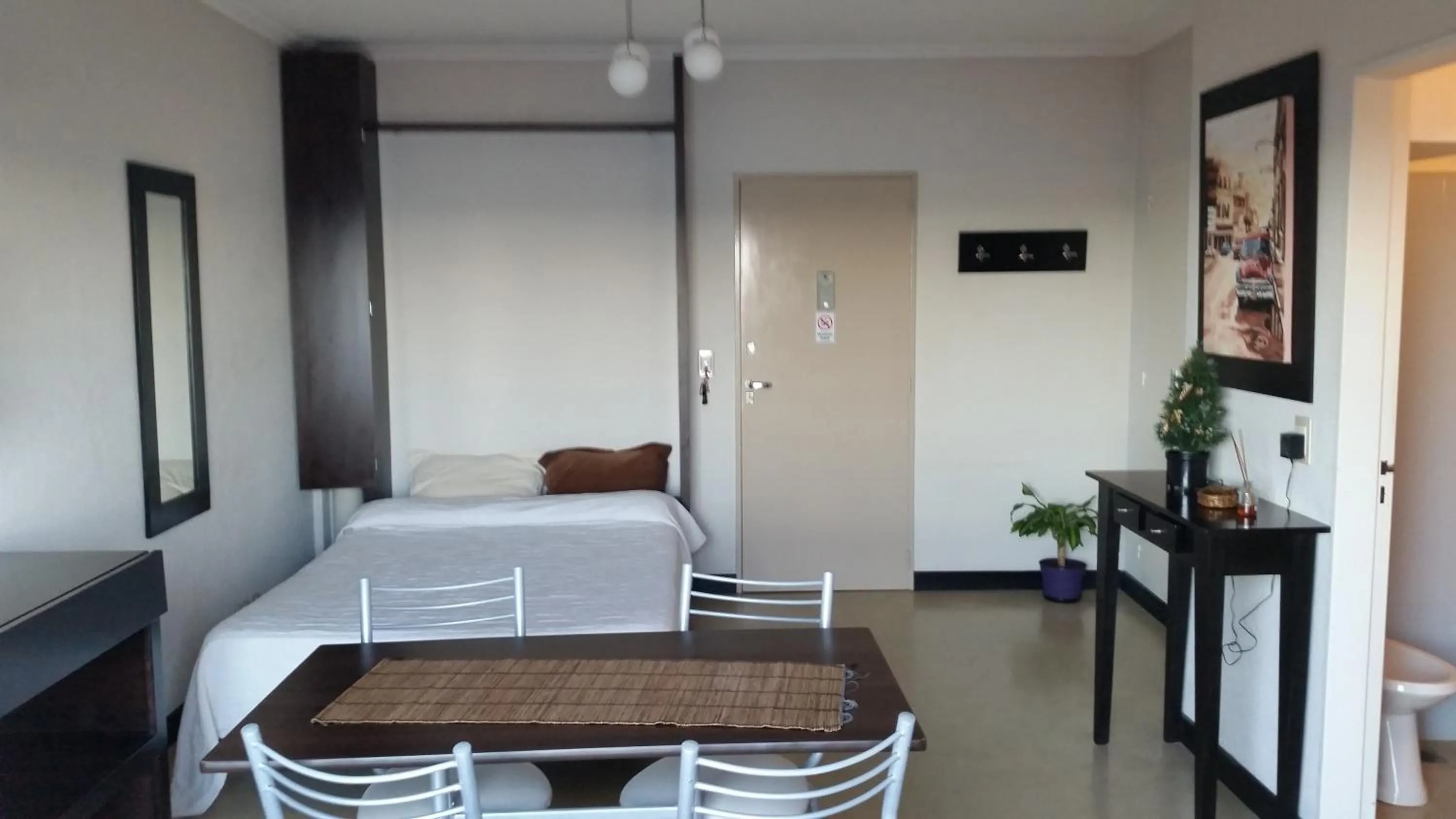 Living room, Bed in Studio Playa Varesse