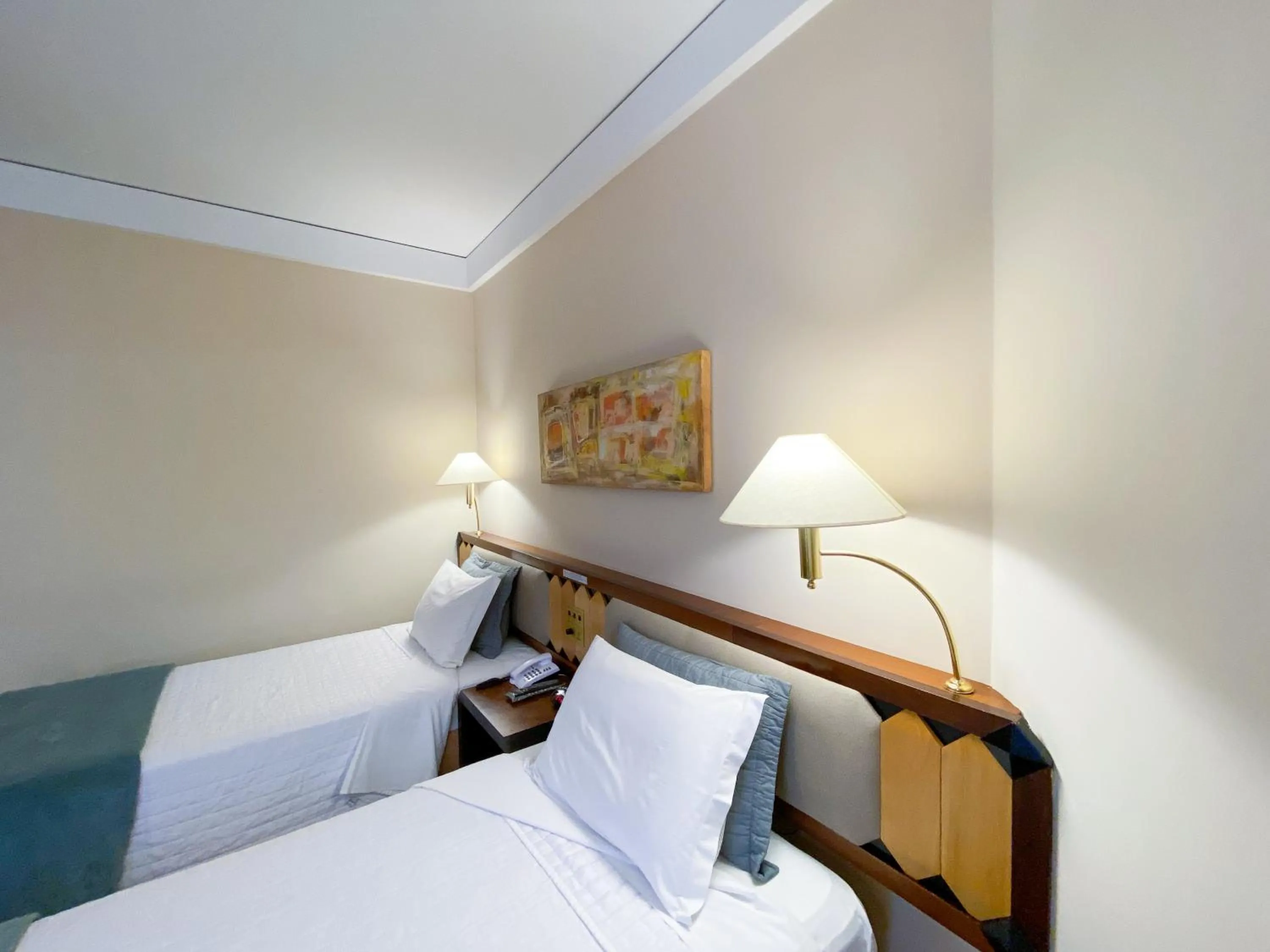 Bed in Golden Tower Pinheiros by Fênix Hotéis