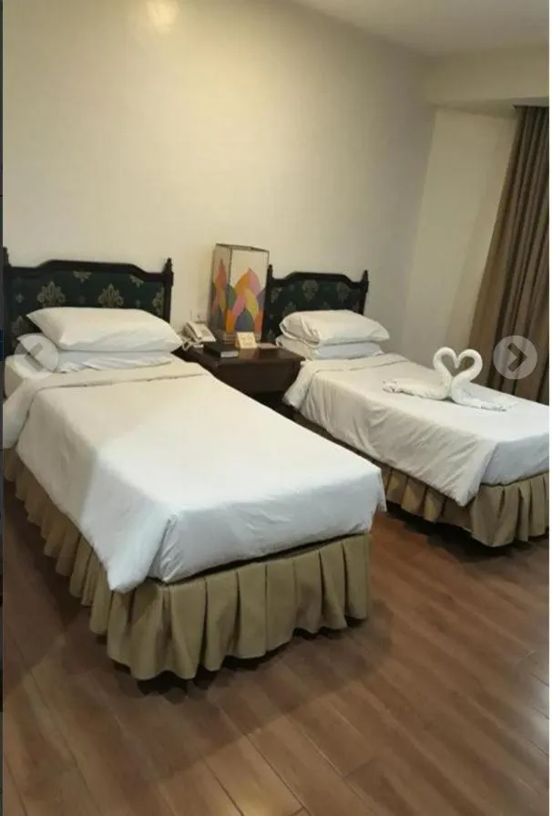 Bed in La Fiesta Hotel